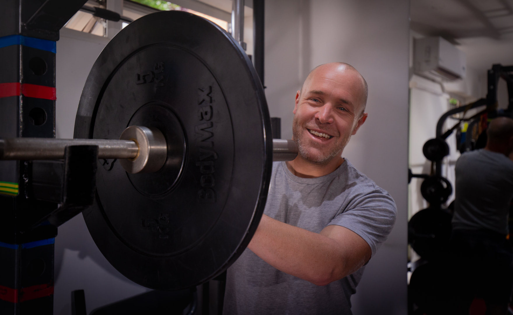 Matt Bryant beside the weights rack in his studio